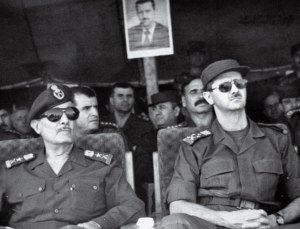 President-elect Lt. Gen. Bashar Assad, right, attends military training games in Syria, July 12, 2000.